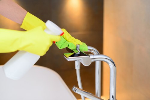Post-build cleaning in a Chiswick home with dust removal on surfaces