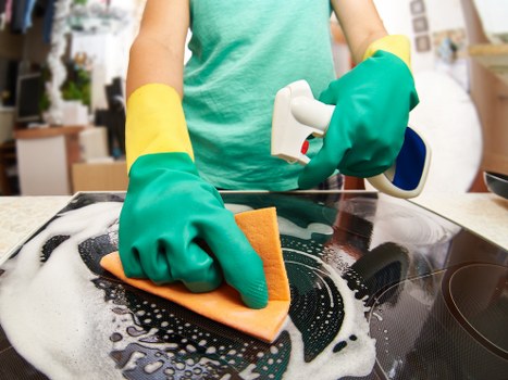 Local carpet cleaner preparing equipment in a Chiswick property